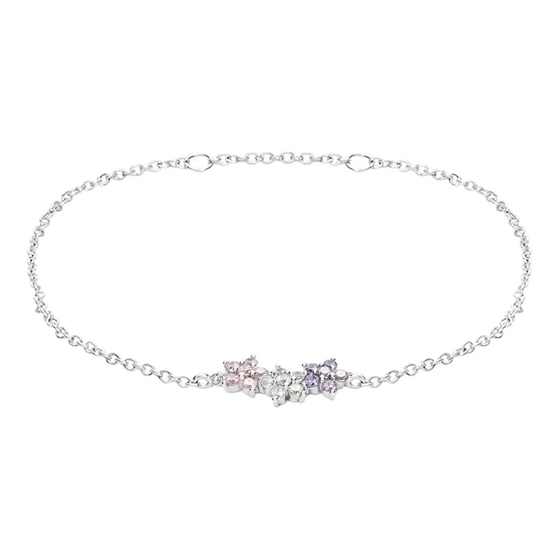 Stroili Delicate Floral Chain Bracelet: silver chain bracelet with pink, white and purple floral gemstone motifs on a wrist