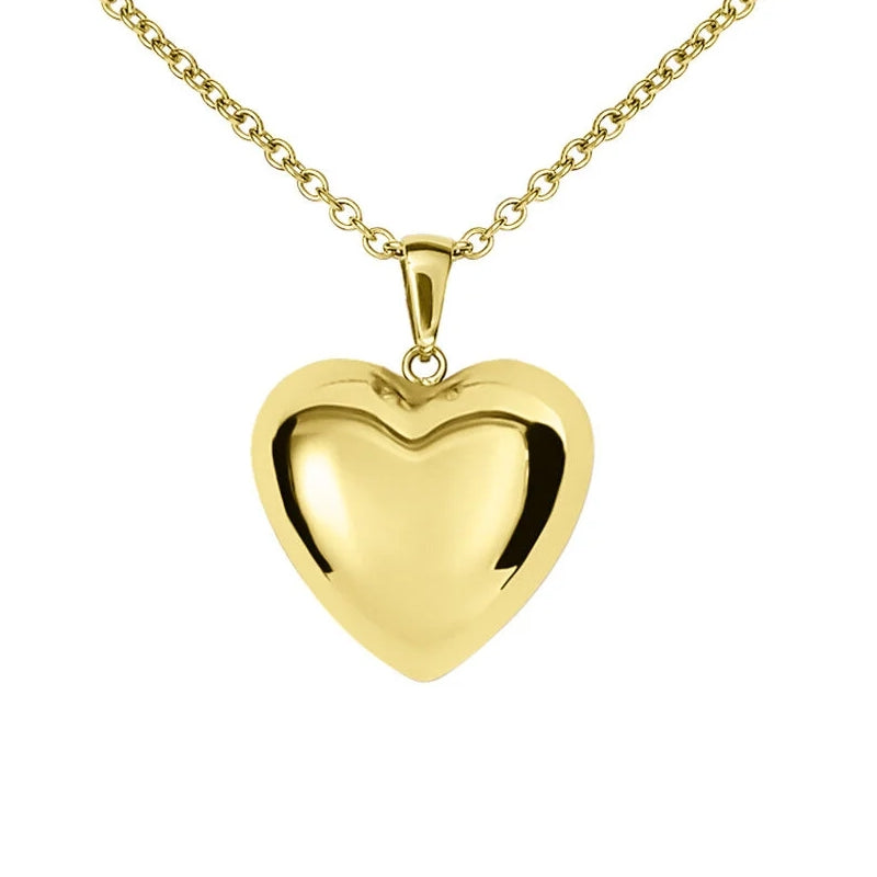 Stroili Gold Heart Necklace: chain necklace with a small heart-shaped pendant resting on a light fabric background